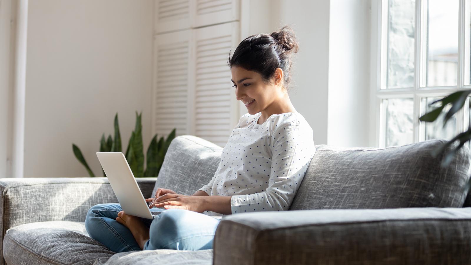 student working on laptop from home