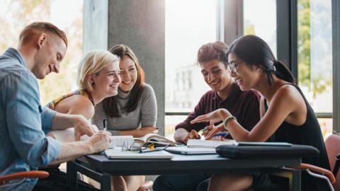 university student sitting at a table