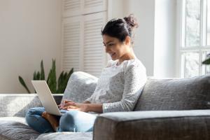 student working on laptop from home